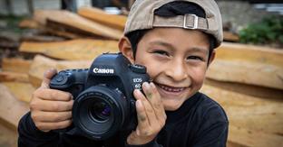 Young boy enjoys photography.