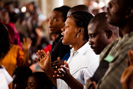 Haitians praying in church