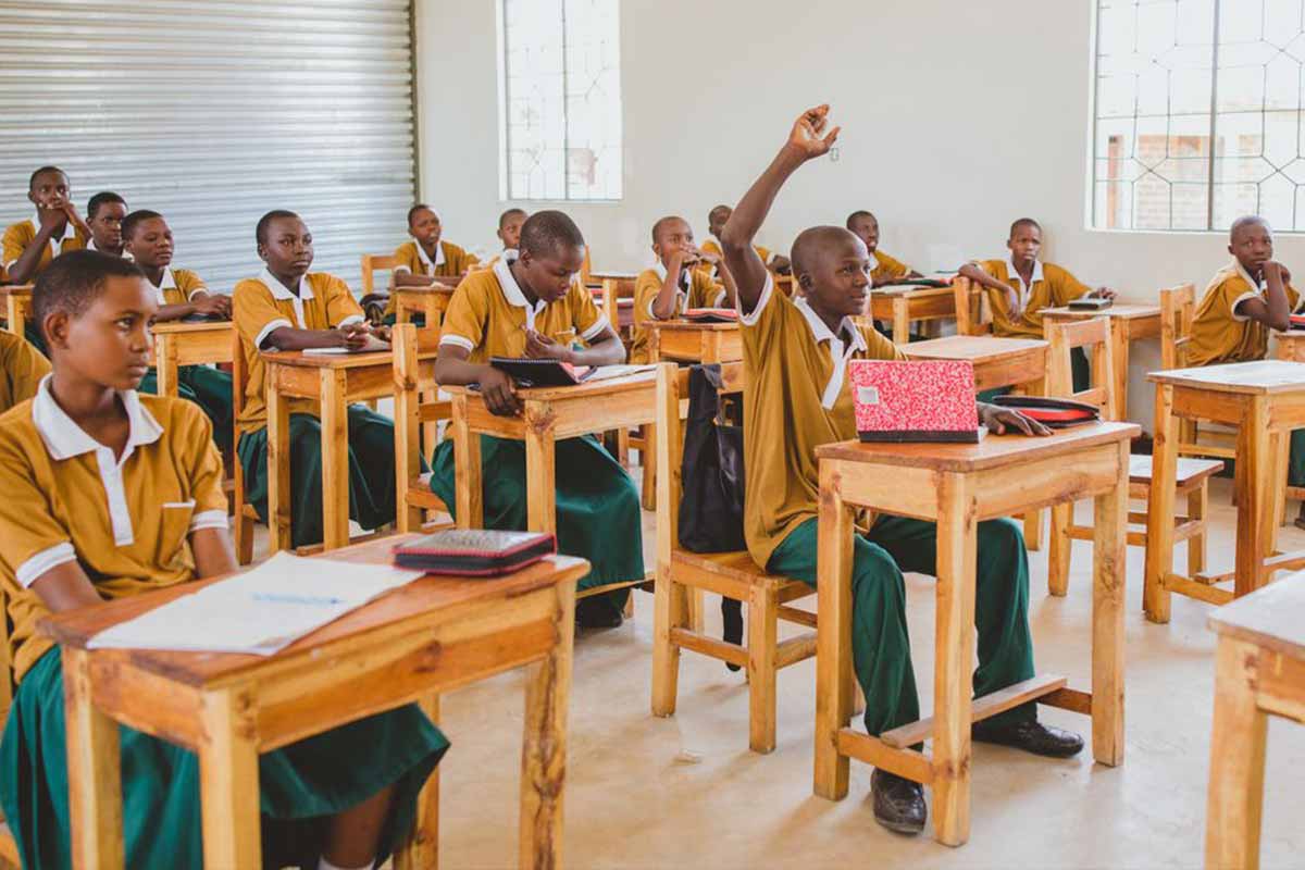 Children in Tanzania sitting at desks in a classroom
