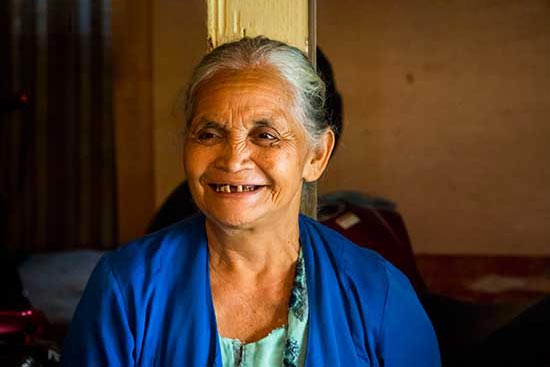 An elderly lady smiling