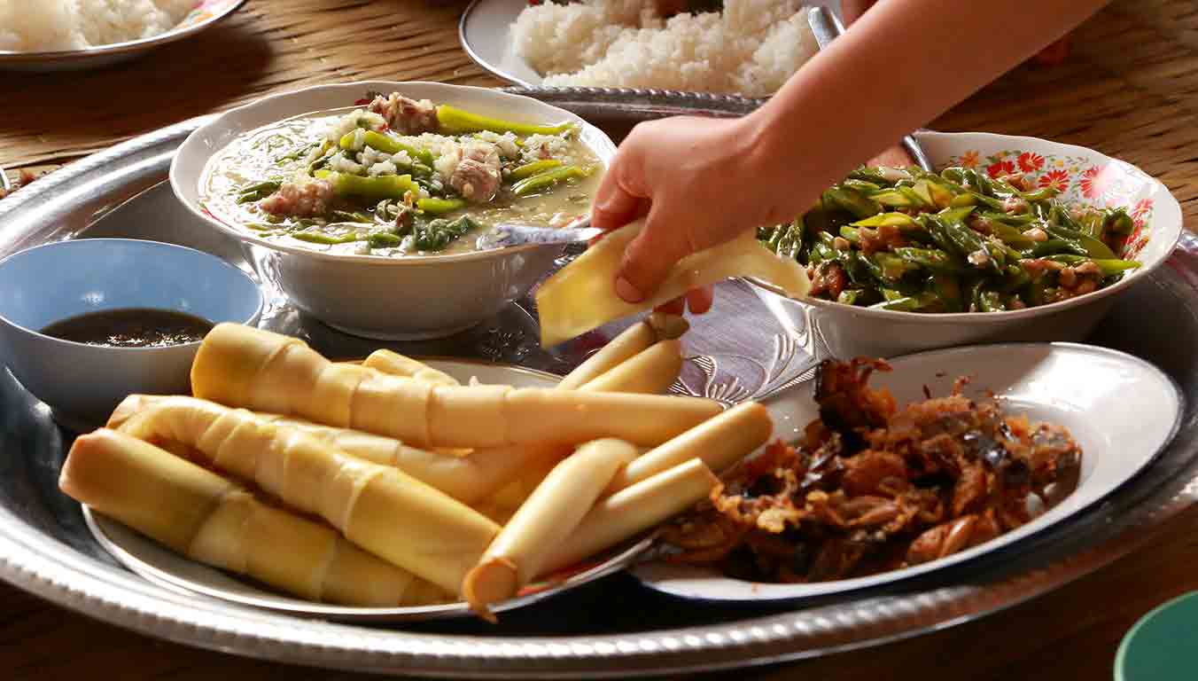 Food on plates for a family in Thailand