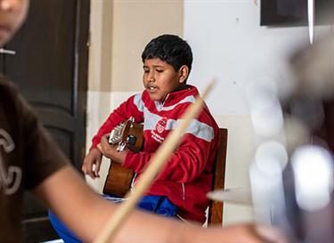Give a child in poverty music lessons