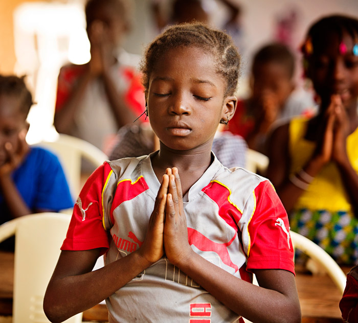 A girl praying in a church