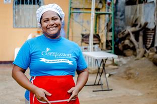 Natividad smiles at the camera