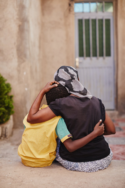 Mother sitting with son