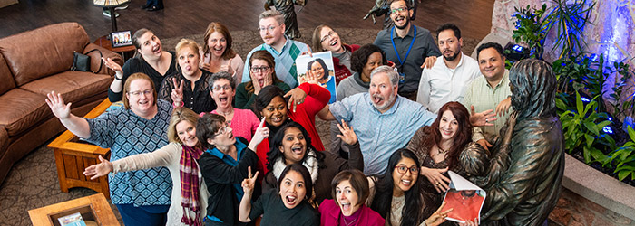 A group of Compassion HR staff all smiling together