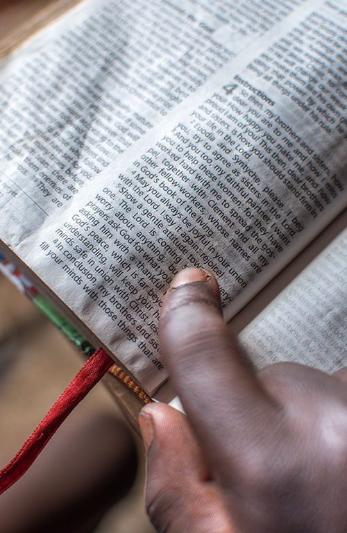 Child reading a bible