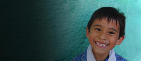 A boy from Mexico smiling