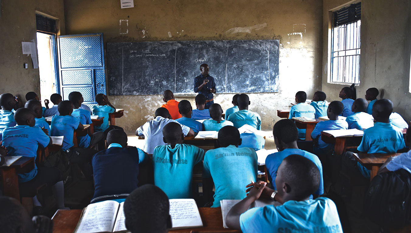 Peter teaches children in Uganda at Compassion Center