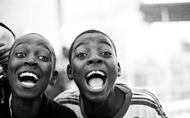 Two Haitian boys laughing together