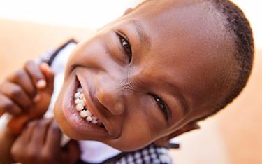 A girl from Burkina Faso smiling