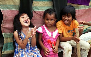 Children in the Philippines laugh together