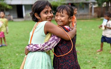 Sejoti hugs her friend at a Compassion center