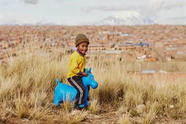 Clever, a 7-year-old Bolivian boy in Compassion’s program plays with a gift from his sponsor