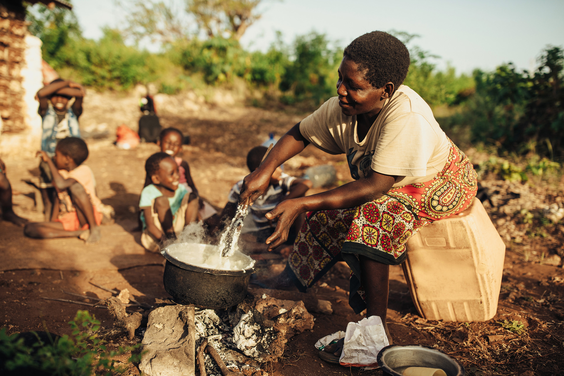 Kadzo, a mother of 14 in Kenya, uses cornmeal to make porridge for her family