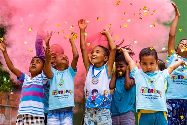 children at a Compassion center in Brazil celebrate the beginning of a new year (pre-COVID-19)