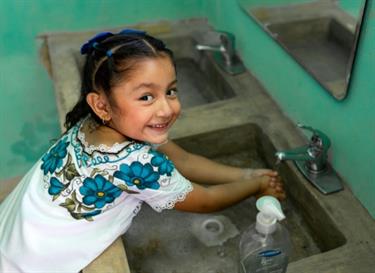 Provide clean bathrooms and hygiene training to children in poverty