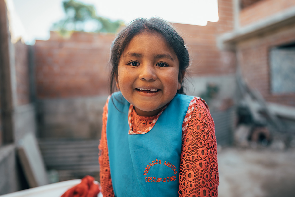 A Bolivian girl smiles at the camera