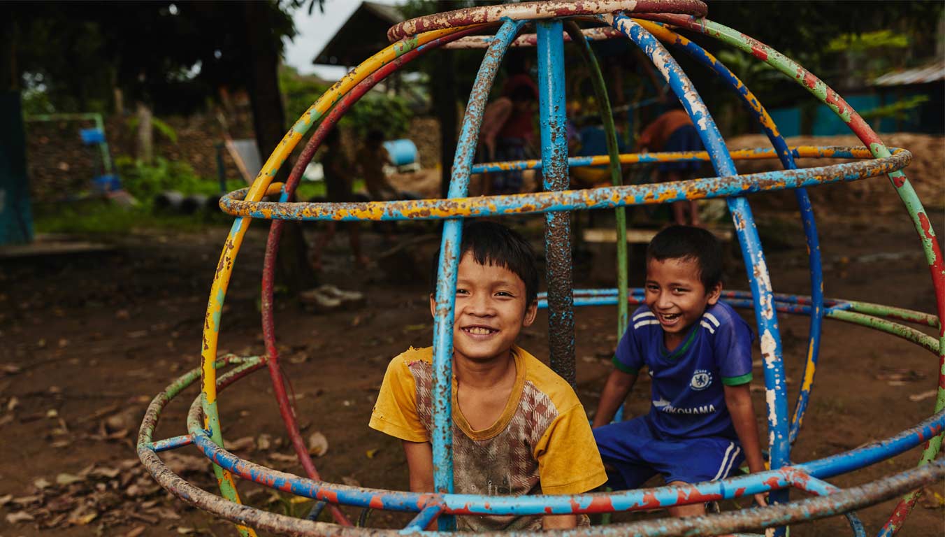 Boys playing on a playground in Thailand
