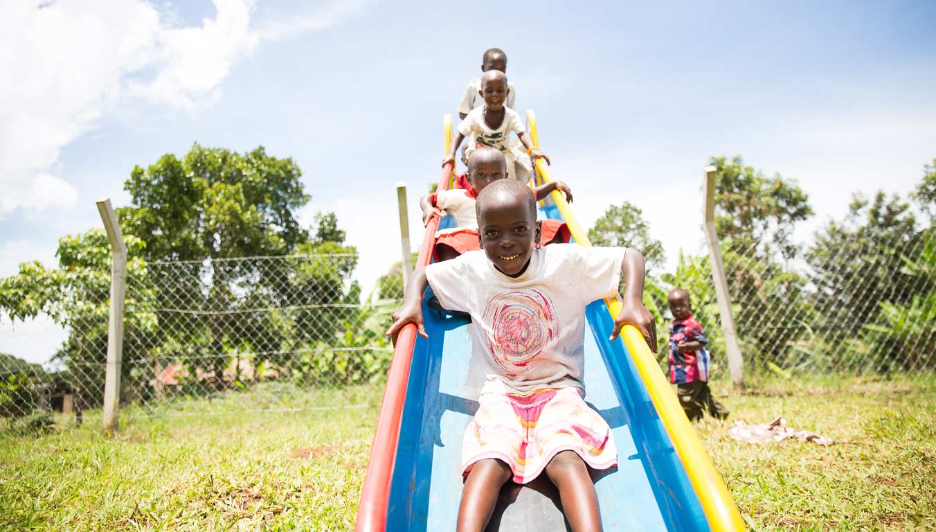 Children playing on a playground in Uganda