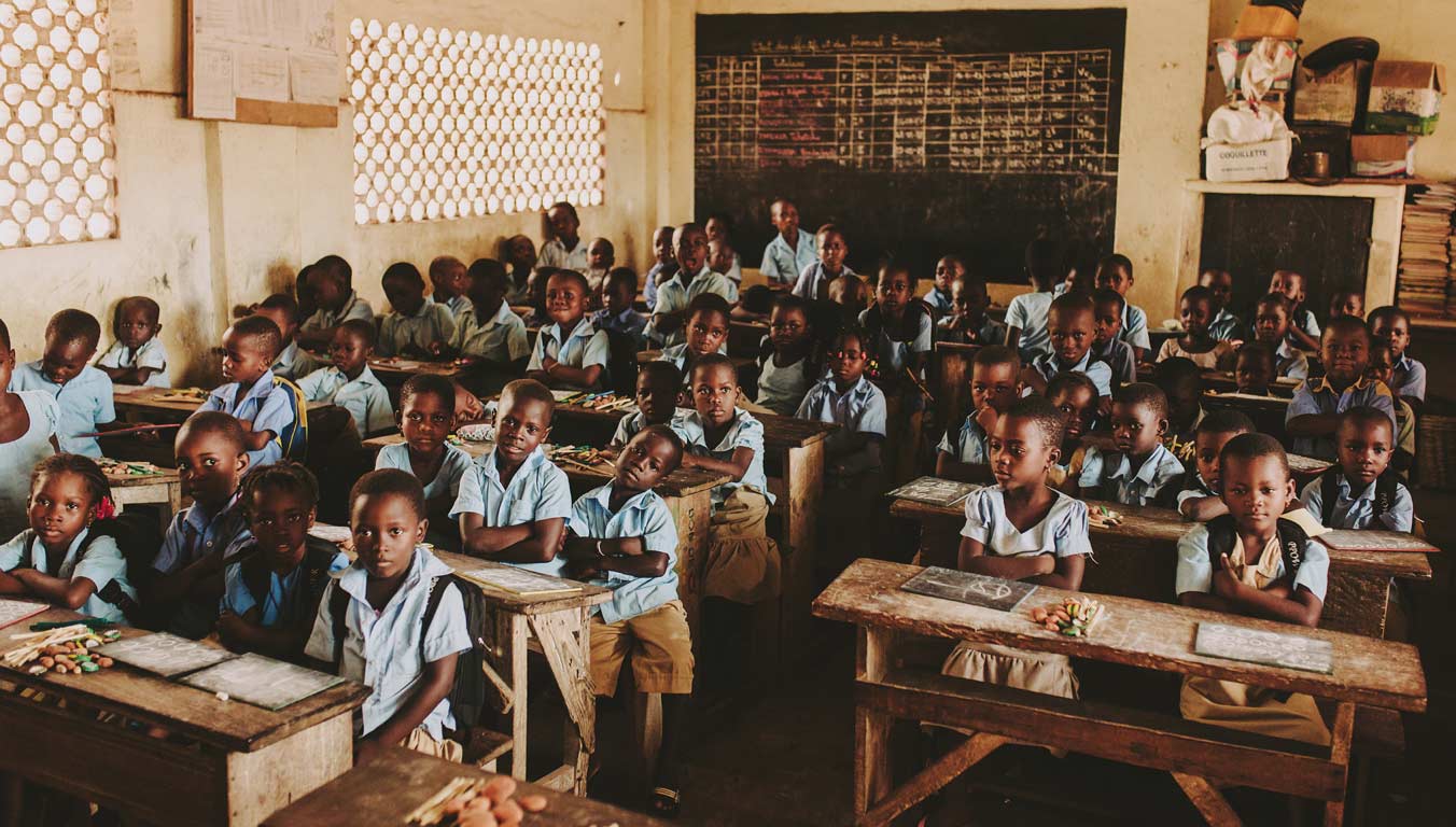 Students listening to teacher in Togo