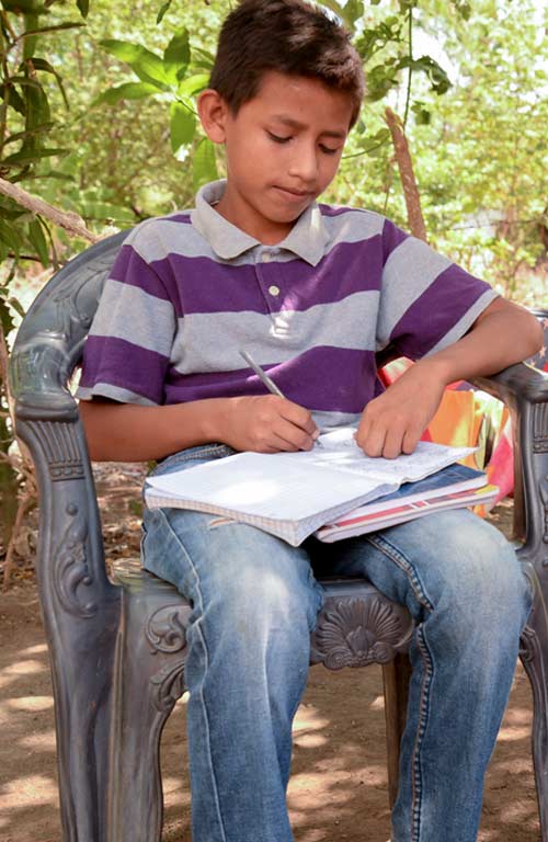 A boy writing in Nicaragua