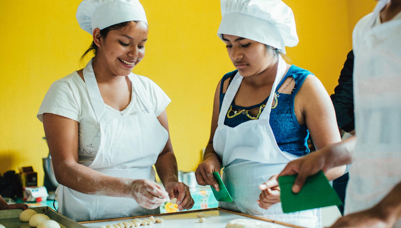 Girls learning how to cook as a vocational skill in El Salvador