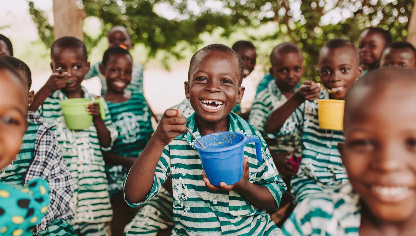 Children enjoying their meal in Togo