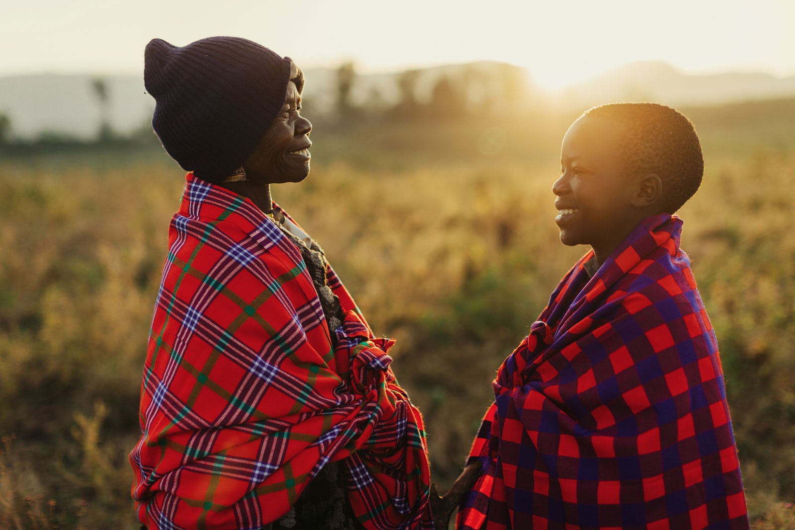 Portraits of orphan, Collins, and his grandmother at sunrise in field nearby their rural home in Solai, Kenya