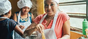 girl learns how to cook