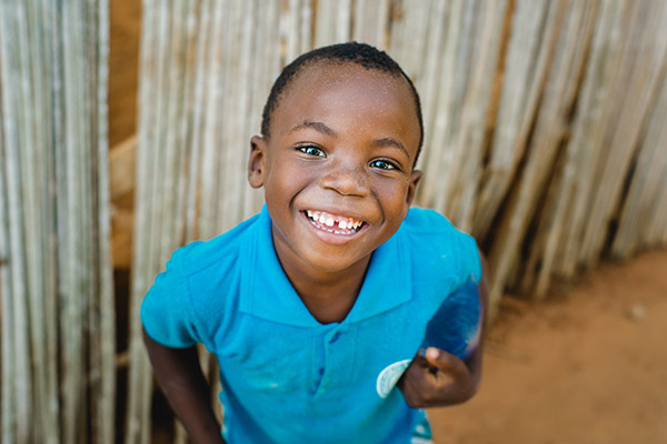 A young child smiling
