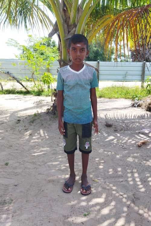 An unsponsored boy named Kanishran from Sri Lanka who has waited 588 days for a sponsor.