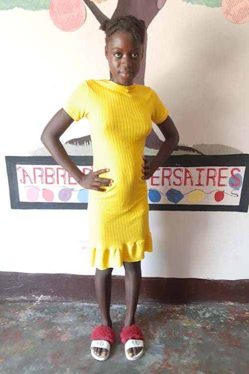 An unsponsored girl named Meenylie from Haiti who is vulnerable to exploitation and has waited 700 days for a sponsor.
