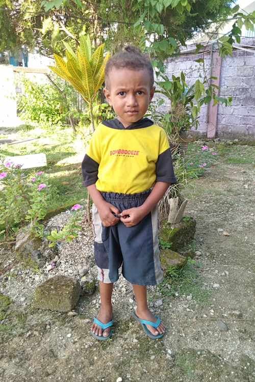 An unsponsored boy named Enok from Indonesia who has waited 479 days for a sponsor.