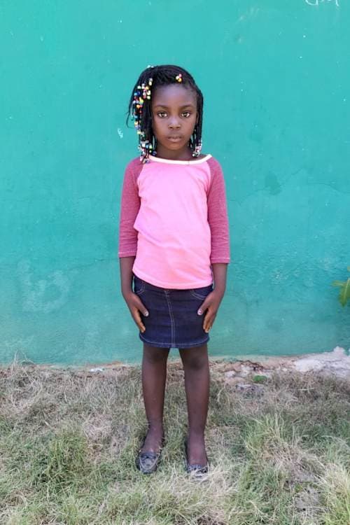 An unsponsored girl named Djiveline from Haiti who is vulnerable to exploitation and has waited 551 days for a sponsor.