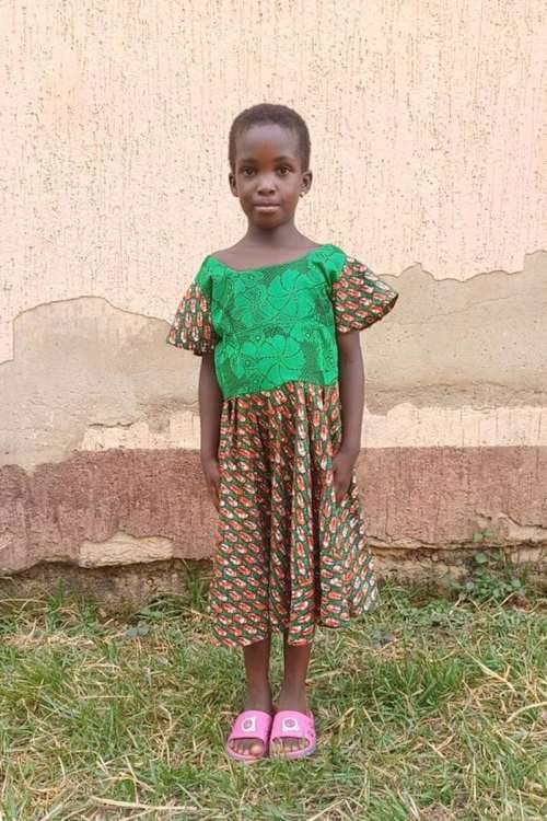 An unsponsored girl named John from Togo who lives in an AIDS-affected area, is vulnerable to exploitation and has waited 506 days for a sponsor.
