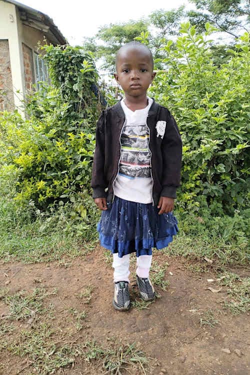 An unsponsored girl named Nchagwa from Kenya who lives in an AIDS-affected area and has waited 478 days for a sponsor.