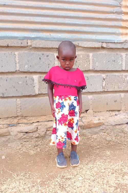 An unsponsored girl named Faith from Kenya who lives in an AIDS-affected area and has waited 453 days for a sponsor.