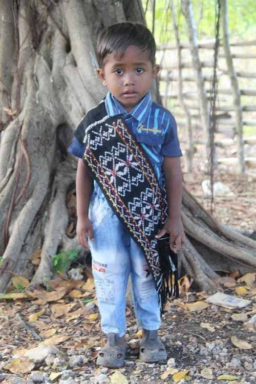An unsponsored boy named El from Indonesia who has waited 475 days for a sponsor.