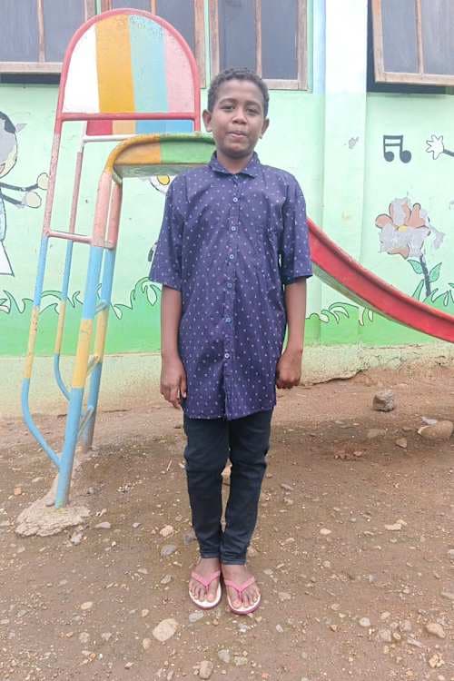 An unsponsored boy named Micky from Indonesia who has waited 543 days for a sponsor.