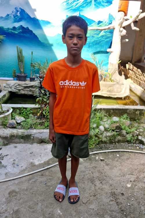 An unsponsored boy named Kevin from Indonesia who has waited 150 days for a sponsor.