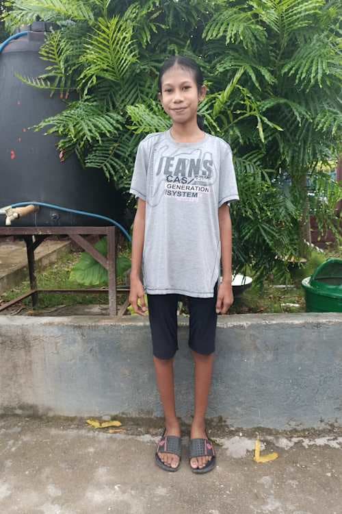 An unsponsored girl named Melan from Indonesia who has waited 513 days for a sponsor.