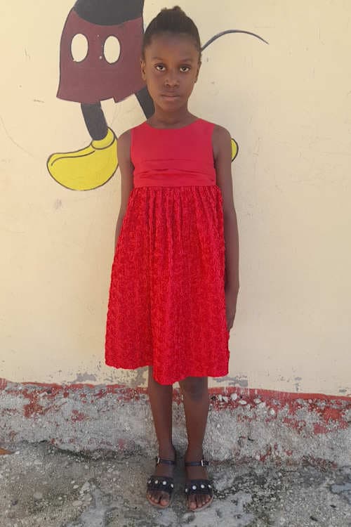An unsponsored girl named Natoue from Haiti who is vulnerable to exploitation and has waited 428 days for a sponsor.