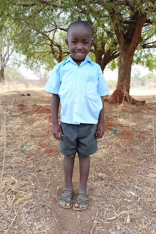 An unsponsored boy named Fikayo from Kenya who lives in an AIDS-affected area and has waited 461 days for a sponsor.