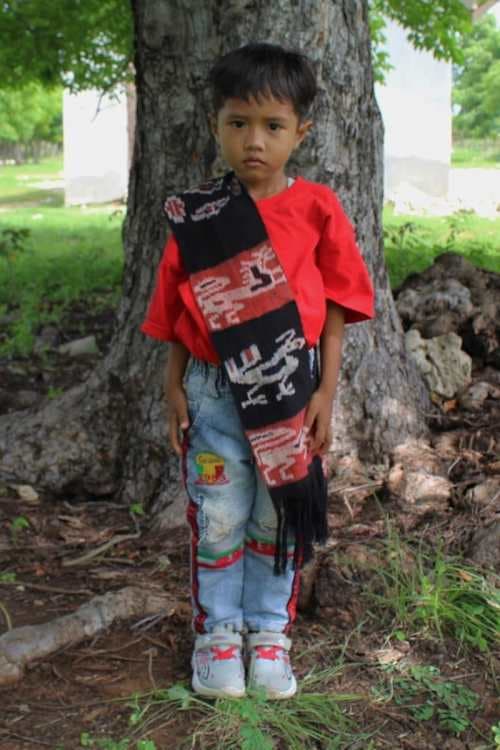 An unsponsored boy named Adrian from Indonesia who has waited 425 days for a sponsor.