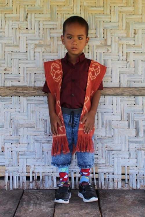 An unsponsored boy named Aya from Indonesia who has waited 425 days for a sponsor.