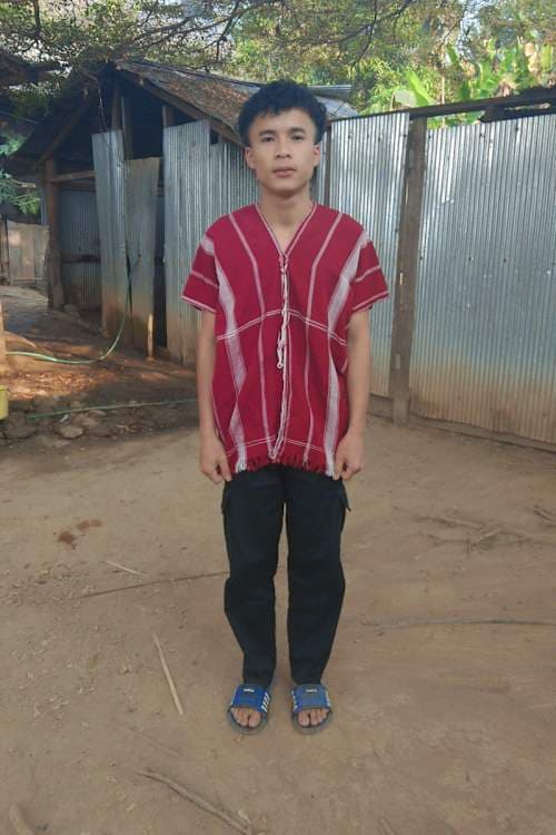 An unsponsored boy named Sadatoo from Thailand who has waited 212 days for a sponsor.