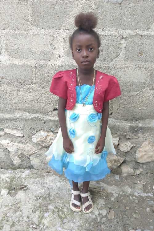 An unsponsored girl named Naydine from Haiti who is vulnerable to exploitation and has waited 421 days for a sponsor.