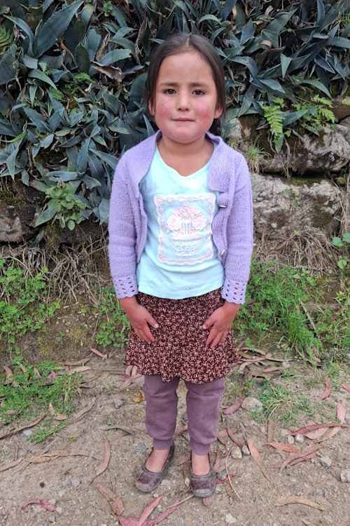 An unsponsored girl named Emely from Peru who has waited 415 days for a sponsor.