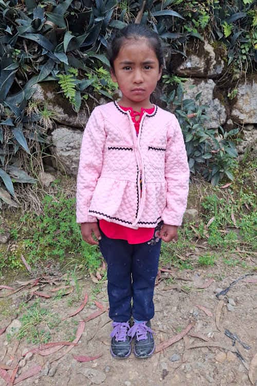An unsponsored girl named Mayte from Peru who has waited 415 days for a sponsor.